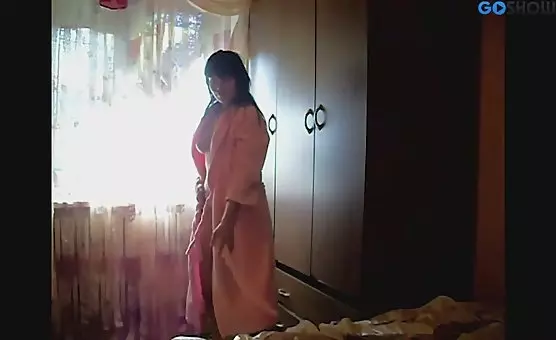 Brunette in Bathrobe Enticingly Teases and Undresses